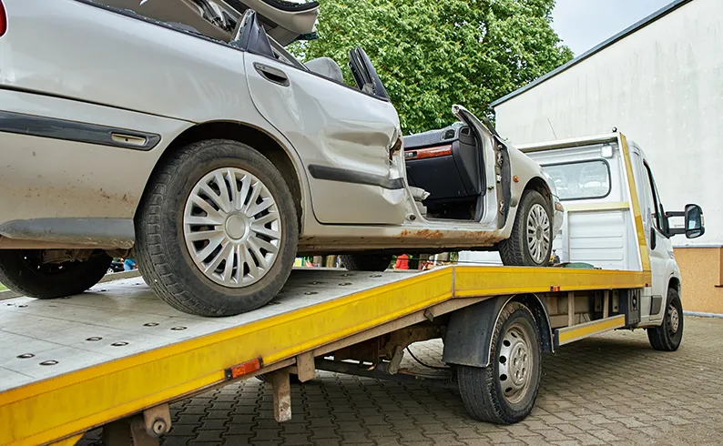 Vehicle on tow truck bed.